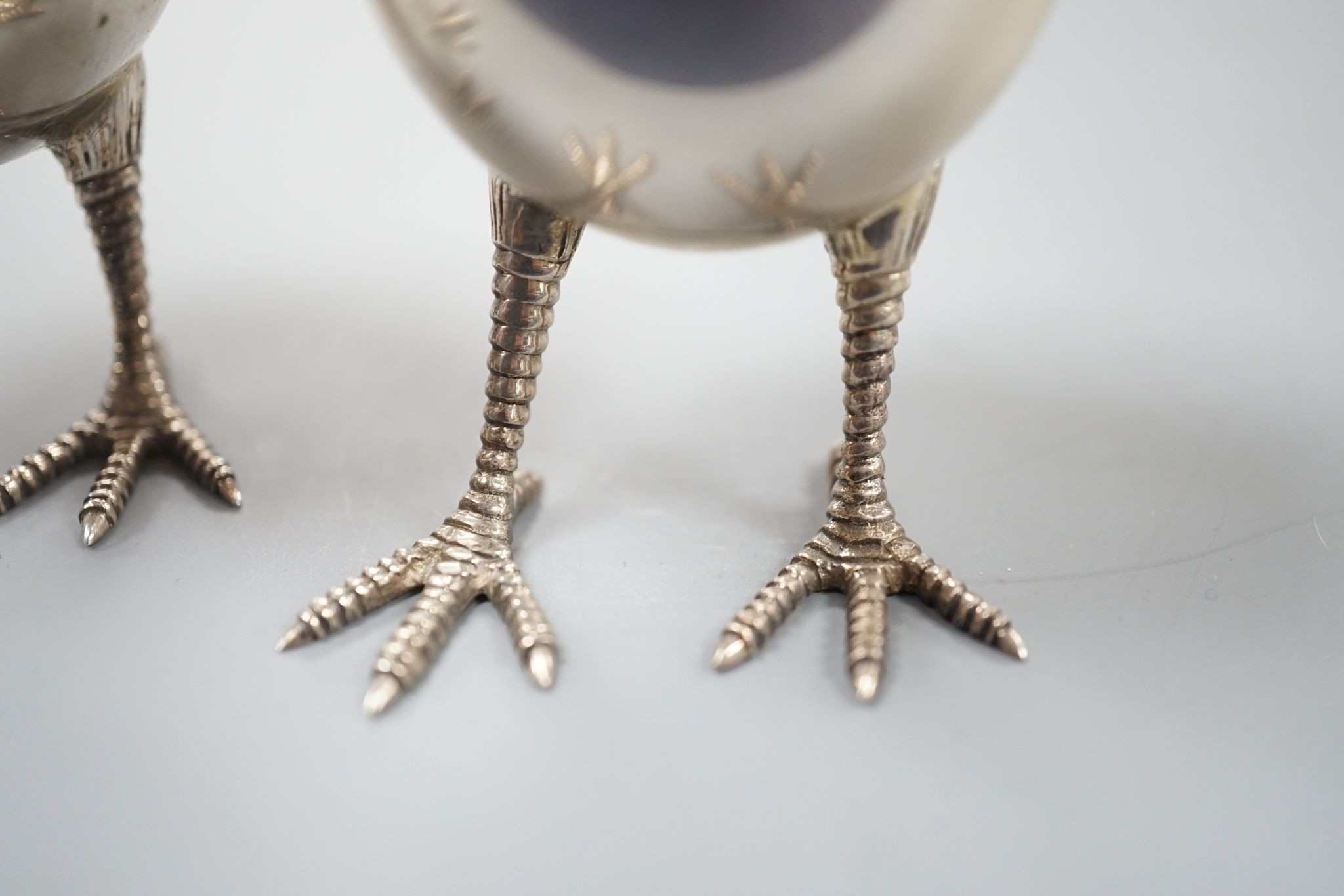 A pair of modern silver eggs on legs pepper and salt condiments, Francis Howard Ltd, London, 2015, 76mm, 124 grams.